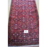 A fine North West Persian Malayer runner central repeat block pattern on red ground. 340cm x .