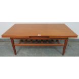 A mid-century Danish teak extending coffee table by Trioh, on tapering supports united by a