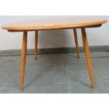 A mid-century blonde elm Windsor circular coffee table by Ercol, on turned canted supports. c1960.