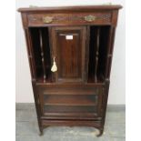 An Edwardian mahogany music cabinet in the Chippendale taste, the top with brass ¾ gallery,