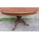 A good Victorian walnut breakfast table, the circular top with an abundance of marquetry inlay in