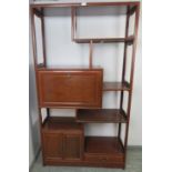 A vintage Chinese hardwood etagere, having a configuration of offset shelves, fall front bureau