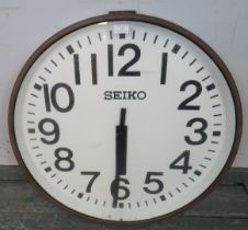 A large vintage Seiko Japanese National Railways wall clock, within a metal casing. Diameter 70cm