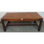 A vintage mahogany & brass campaign style coffee table, on square supports with an ‘H’ stretcher.