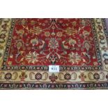 A North West Persian Tabriz carpet. Central floral design on red ground. 205cm x 145cm. Condition