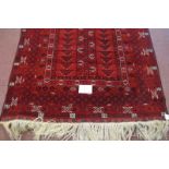 A 20th century rug central repeat pattern n red ground. Very clean rug. 230cm max x 124cm.