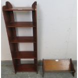 An Edwardian mahogany narrow bookcase of five open shelves, on stile supports. Together with an