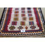 A South West Persian Qashqai Kilim rug, strong colours. 220cm x 125cm. C0ndition report: See