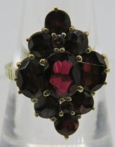 A 9ct yellow gold garnet diamond shaped cluster ring. Centre garnet approx 8cm x 6cm. Size O. 4.4