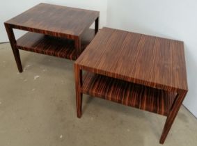 A pair of mid-century coromandel two-tier side tables, on tapering square supports. H64cm W80cm