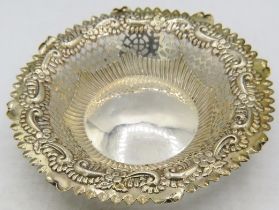 A circular bon bon dish embossed with flowers & scrolls and pierced decoration, Chester 1896. Approx