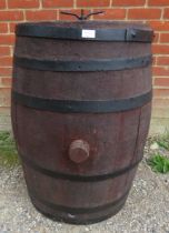 A 19th century Italian oak coopered wine barrel, with cast iron fittings and original stoppers.