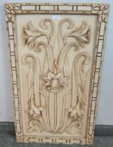 A vintage wall hanging composite panel in the Art Nouveau taste, depicting daffodils moulded in high