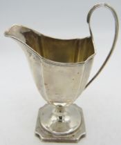 A Georgian silver cream jug on a pedestal, London 1792. Approx 6"/15cm high, approx weight 4.9