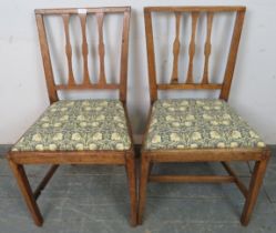 A pair of Georgian light mahogany occasional chairs with drop-in seat pads re-upholstered in William