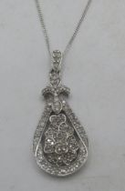 A 9ct white gold pear shaped pendant encrusted with diamonds on a fine white metal chain, clasp