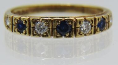 A 9ct yellow gold four diamond & three sapphire set ring, size N. Diamonds approx 0.2cts, approx