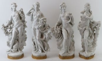 A large set of four Royal Worcester porcelain ‘Four Seasons’ maiden figurines by Sir Arnold