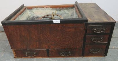 A vintage Japanese cypress wood Hibachi room heater, having a copper lined fire pit, the base