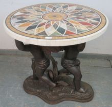 A good Regency style circular specimen marble table on a figural bronze base in the form of winged