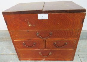 A vintage Japanese elm table-top cabinet, with loose lid, housing two short and two long drawers