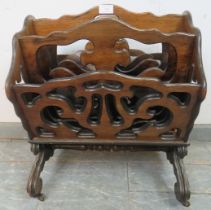 A 19th century rosewood Canterbury, the carved and pierced panels housing four divided compartments,