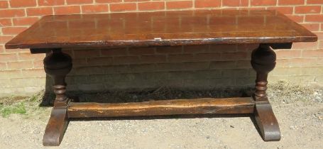 A 17th century and later oak refectory table of good colour, on turned cup and cover supports with