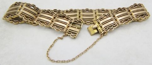 A 9ct yellow gold gate link bracelet with-safety chain, approx weight 24.5 grams. Condition