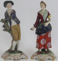 A pair of Georgian Derby figurines, early 19th century. Derby iron red painted marks beneath. (2