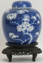 A Chinese blue and white ginger jar and cover, 19th century. Of ovoid form, decorated with