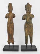 A pair of Cambodian bronzed metal statues of the King and Queen of Cambodia in the Khmer style, 20th