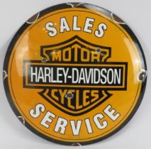 A vintage Harley Davidson Motorcycles Sales and Service enamelled metal sign. Of circular convex