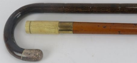 Two walking canes, 19th century. Comprising a malacca walking cane with tapered shaft, turned bone