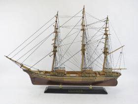 A wooden model of the Thermopylae clipper ship. Displayed on a base with brass supports. 96 cm