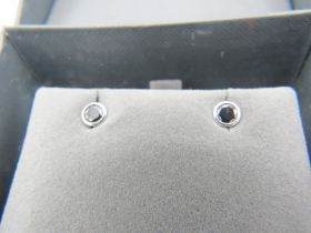 A pair of black diamond & 14ct white gold ear studs, stamped '585', clarity believed to be VVS1,