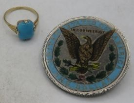 An American 1 dollar with enamelling to one side made into a brooch. Coin 1889 and a 9ct yellow gold