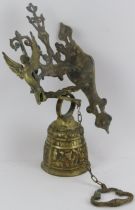 A cast brass Monastery bell, inscribed 'Vocem Meam Audit Qui Me Tangit’. With wall bracket