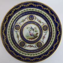 A French Sèvres gilt and polychrome enamelled porcelain cabinet plate, mid 18th century. Hand gilt