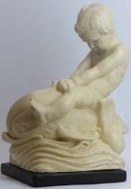 A large British cream glazed ceramic figure of a putti riding a dolphin, 20th century. Provenance:
