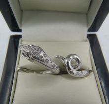 A fine and unusual Boucheron 18ct white gold & 24 diamond designer snake ring. Diamonds approx 0.