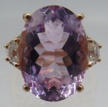 A silver gilt ring set with an oval faceted solitaire pink amethyst, approx 18mm x 12mm, size Q,