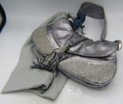 A Francesco Biasia silver leather evening bag with metal beadwork decoration and fancy tassel,