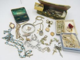An assortment of jewellery to include an engraved silver bangle, Chester 1954, a silver sweetheart