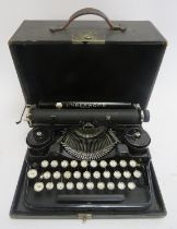An American Underwood standard portable typewriter. Housed in a black leather carry case. Box: 31.
