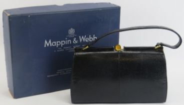 A Mappin & Webb black lizard skin handbag. With gilt metal mounts and clasp, the interior with a zip
