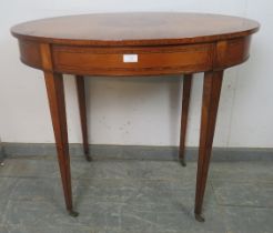 A fine 19th century satinwood oval table, crossbanded and strung with ebony and boxwood, the