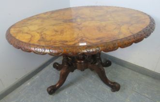 A Victorian figured walnut tilt-top loo table, the quarter veneered top with marquetry inlay and