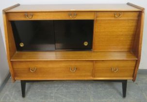 A vintage teak sideboard/drinks cabinet by G-Plan, housing a selection of two long and two short