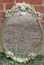 An antique wall mirror within a gilt gesso frame with moulded cornice and pierced acanthus scrolling