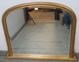 A vintage 19th century style bevelled overmantle mirror, within an arched giltwood frame with